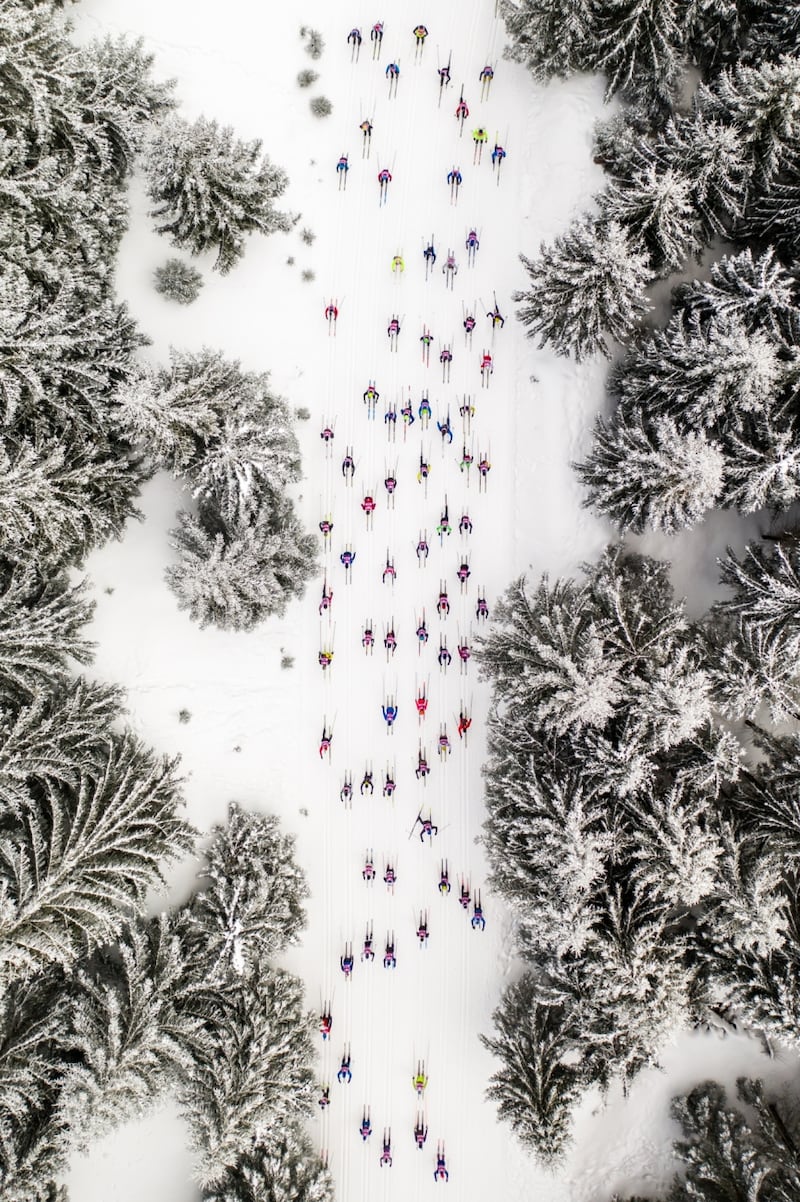 An aerial view of the participants of the Bieg Piastow ski event held in Poland, by Polish photographer Daniel Koszela, won in the Sports category.