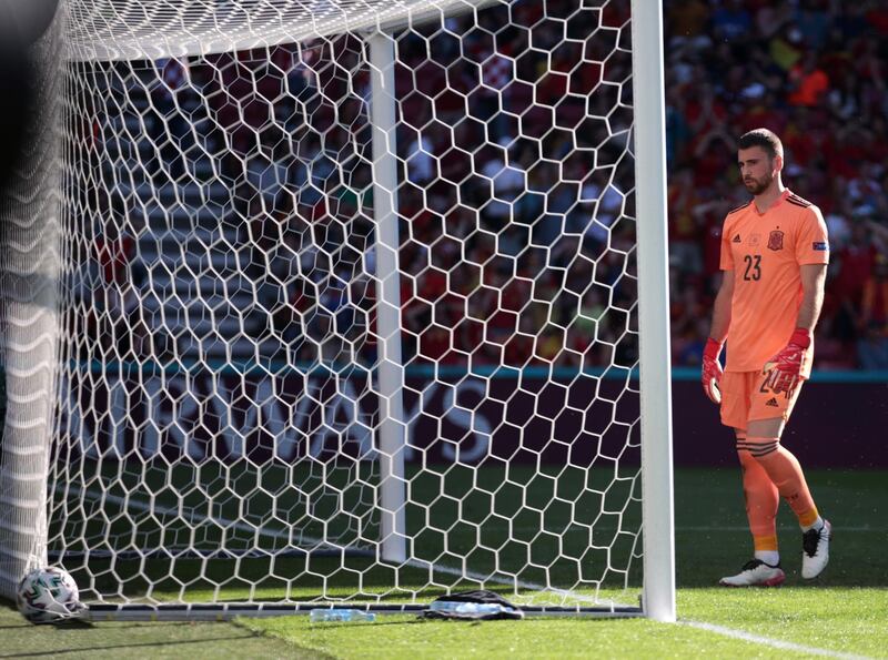 Spain goalkeeper Unai Simon goes to pick the ball out of the net after his horrendous error for Croatia's goal.
