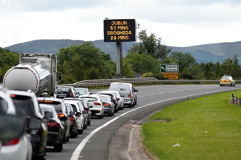 A police vehicle stops traffic beside a sign for customs and excise on the motorway approaching the border between Northern Ireland and Ireland, near Newry, Northern Ireland. The UK’s Brexit from the EU is scheduled for the end of March 2019. Clodagh Kilcoyne/Reuters