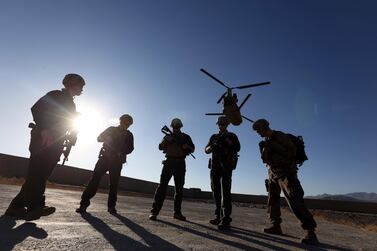 In this November 30, 2017 file photo, American soldiers wait on the tarmac in Logar province, Afghanistan. Top officials in the White House were aware in early 2019 of classified intelligence indicating Russia was secretly offering bounties to the Taliban for the deaths of American soldiers. AP