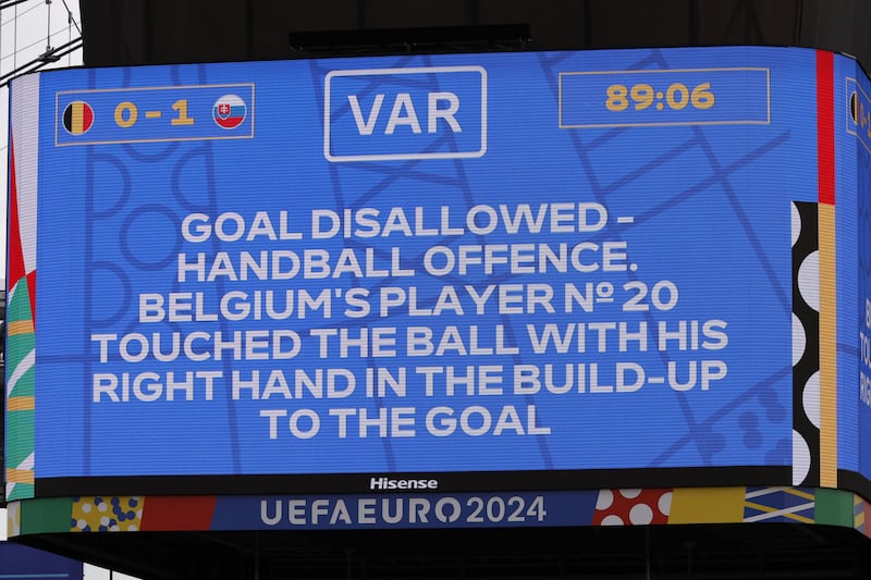 A big screen at the game shows the VAR decision given against Belgium after Romelu Lukaku scored. EPA