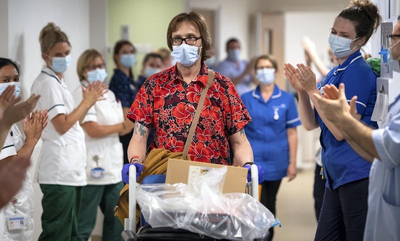 Heart transplant patient Richard Priest being clapped out by staff as he leaves Royal Papworth Hospital, Cambridge, after being in the hospital for more than 200 days, throughout the entire coronavirus pandemic. (Photo by Joe Giddens/PA Images via Getty Images)