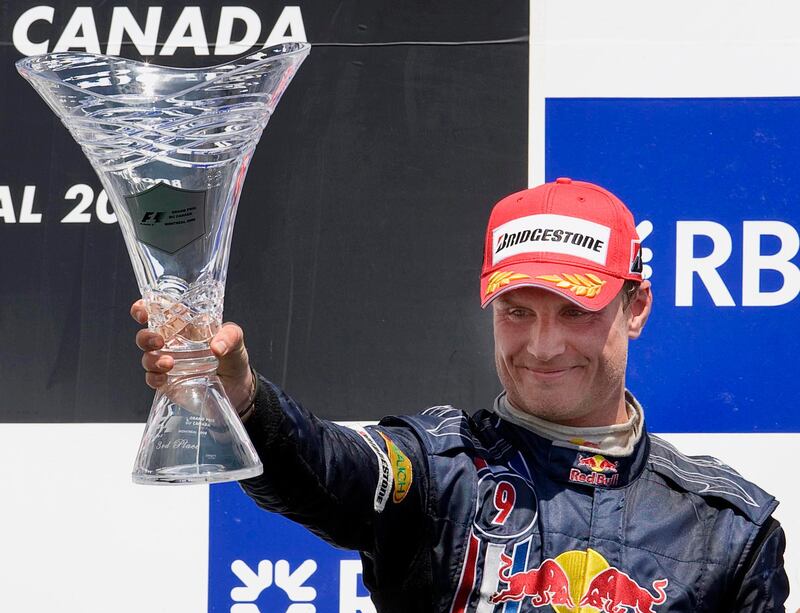 Red Bull Racing's David Coulthard, of Britain, holds up his trophy after placing third behind winner BMW Sauber Robert Kubica during the Canadian Grand Prix at the Circuit Gilles-Villeneuve, Sunday, June 8, 2008 in Montreal, Canada.  (AP Photo/The Canadian Press, Paul Chiasson)