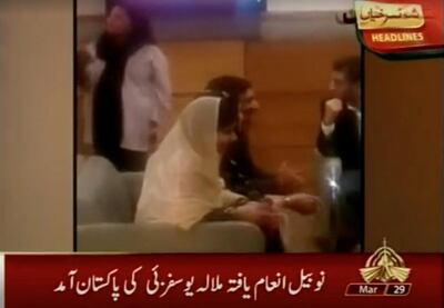 Nobel laureate and education activist Malala Yousafzai sits with her family in a VIP lounge of Islamabad Airport upon her arrival in Islamabad, Pakistan, in this still image taken from PTV video footage released on March 29, 2018. PTV/via REUTERS ATTENTION EDITORS - THIS IMAGE HAS BEEN SUPPLIED BY A THIRD PARTY. NO RESALES. NO ARCHIVES. PAKISTAN OUT. NO COMMERCIAL OR EDITORIAL SALES IN PAKISTAN