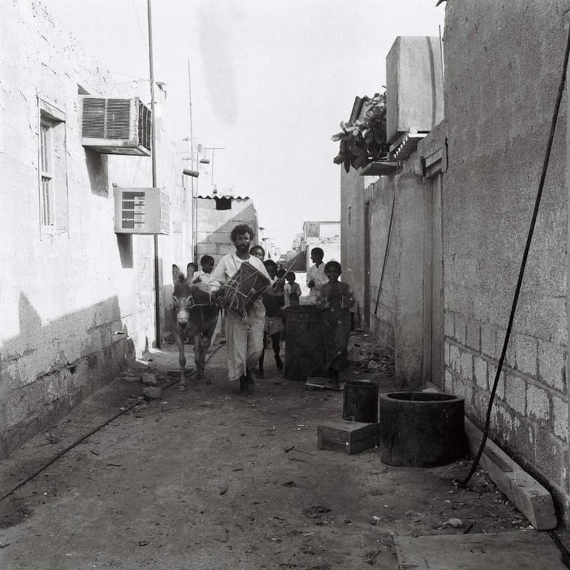 Drummer Khamees Abu Tubaila and his entourage walk the alleyways of Abu Dhabi to wake residents and prepare them for the day’s fasting. Photo: Al Ittihad