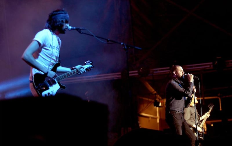Sergio Pizzorno, left, and Tom Meighan, of Kasabian perform on stage at Blended 2015 at Media City Amphitheatrein Dubai. Satish Kumar / The National 