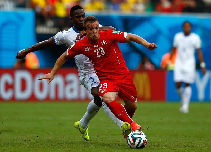 Xherdan Shaqiri of Switzerland controls the ball as Maynor Figueroa of Honduras gives chase during their match on Wednesday at the 2014 World Cup in Manaus, Brazil. Matthew Lewis / Getty Images