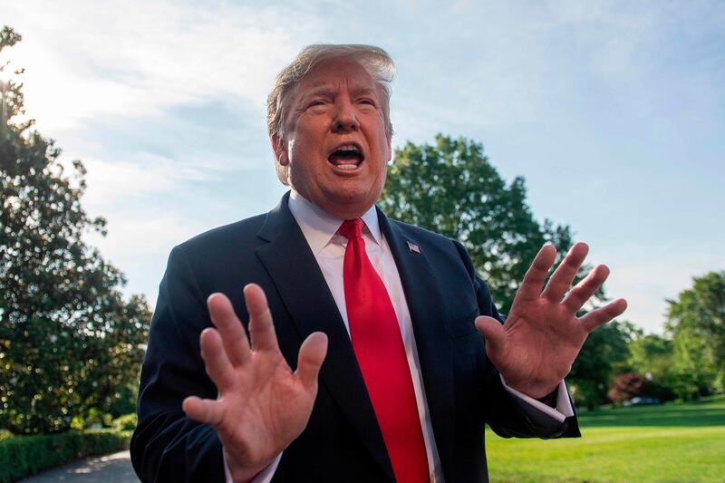 (FILES) In this file photo taken on May 30, 2019 US President Donald Trump speaks with reporters as he departs the White House, in Washington, DC. US President Donald Trump denied on June 2, 2019 that he had called Meghan Markle "nasty" just days before heading to Britain to be hosted, and lavishly feted, by other members of the royal family.And yet the remark about the American-born Dutchess of Sussex is heard clearly on a tape of a Trump interview with the British tabloid The Sun.  Trump's tweet Sunday came a day before his three-day state visit is to begin with a pomp-filled ceremony at Buckingham Palace followed by lunch with 93-year-old Queen Elizabeth I.
 / AFP / Jim WATSON
