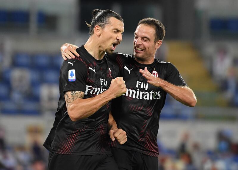 Zlatan Ibrahimovic celebrates with teammate Giacomo Bonaventura after scoring Milan's second goal from the penalty spot in their 3-0 Serie A victory over Lazio at the Stadio Olimpico on Saturday, July 4. Reuters