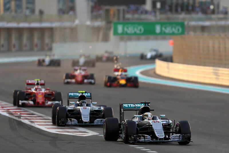 ABU DHABI, UNITED ARAB EMIRATES - NOVEMBER 27:  Lewis Hamilton of Great Britain driving the (44) Mercedes AMG Petronas F1 Team Mercedes F1 WO7 Mercedes PU106C Hybrid turbo leads Nico Rosberg of Germany driving the (6) Mercedes AMG Petronas F1 Team Mercedes F1 WO7 Mercedes PU106C Hybrid turbo and Kimi Raikkonen of Finland driving the (7) Scuderia Ferrari SF16-H FAterrari 059/5 turbo (Shell GP)  the start during the Abu Dhabi Formula One Grand Prix at Yas Marina Circuit on November 27, 2016 in Abu Dhabi, United Arab Emirates.  (Photo by Clive Mason/Getty Images)