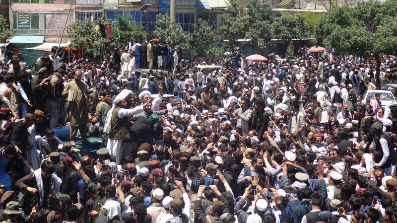 Alleged Taliban militants meets Afghan people as a group of Taliban visits to greet people, as a goodwill gesture amid a three-day ceasefire on second day of Eid al Fitr, in Paktia, Afghanistan, on June 16, 2018. STR / EPA