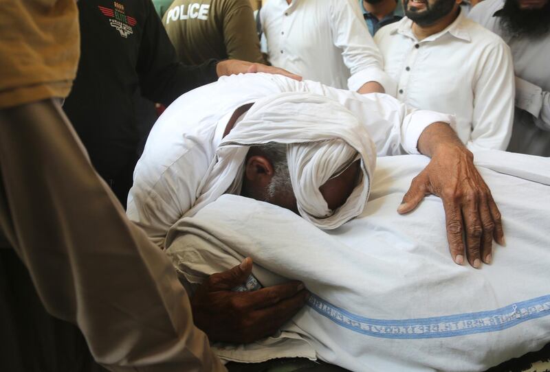 A man mourns the death of his family member outside a hospital in Lahore, Pakistan. A suicide bomber attacked security forces guarding a famous Sufi shrine in Pakistan's eastern city of Lahore, police said. AP Photo