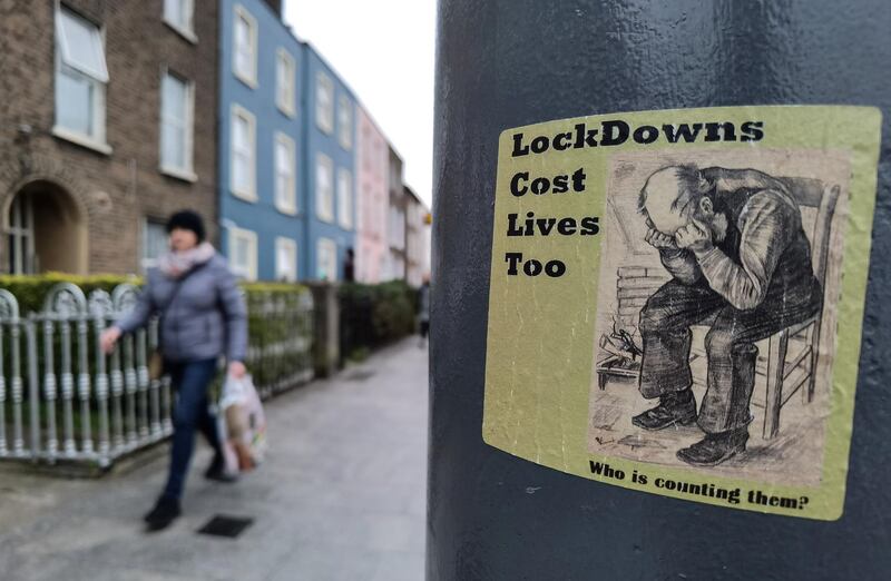 A sticker reading 'LockDowns Cost Lives Too' seen on a lamp post in Dublin during Level 5 Covid-19 lockdown. 
On Tuesday, 9 March, 2021, in Dublin, Ireland. (Photo by Artur Widak/NurPhoto via Getty Images)