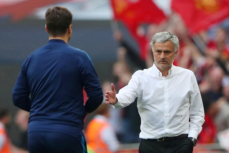 Jose Mourinho embraces Tottenham manager Mauricio Pochettino. Reuters