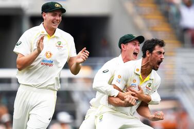 Mitchell Starc (R) of Australia celebrates with Cameron Green (L) and Marnus Labuschagne (C) after getting the wicket of Rory Burns of England during day one of the First Ashes Test between Australia and England at The Gabba in Brisbane, Australia, 08 December 2021.   EPA / DARREN ENGLAND  EDITORIAL USE ONLY, IMAGES TO BE USED FOR NEWS REPORTING PURPOSES ONLY, NO COMMERCIAL USE WHATSOEVER, NO USE IN BOOKS WITHOUT PRIOR WRITTEN CONSENT FROM AAP AUSTRALIA AND NEW ZEALAND OUT