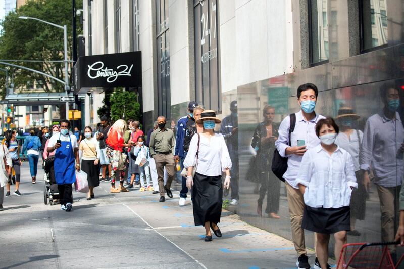 Customers stand in line to enter a Century 21 department store in New York, U.S., on Monday, Sept. 14, 2020. Century 21 Stores, an iconic New York off-price department store chain, filed for bankruptcy with plans to shut down, becoming the latest victim of the retail industry carnage that's accelerated during the pandemic. Photographer: Michael Nagle/Bloomberg