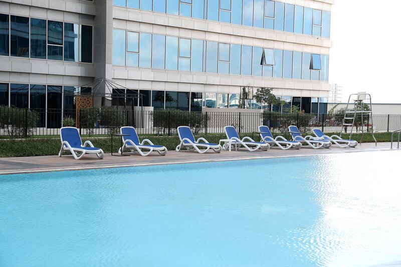 View of the swimming pool area at the Skycourts tower D in Dubailand in Dubai. 