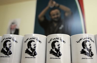Mugs bearing a portrait of jailed Fatah leader Marwan Barghouti, reading in Arabic 'Freedom for the knight of freedom', displayed at an office campaigning for his release in the West Bank city of Ramallah in 2009. AFP