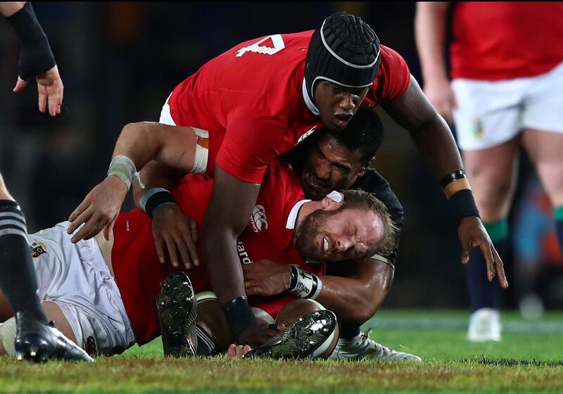 AUCKLAND, NEW ZEALAND - JULY 08:  Alun Wyn Jones of the Lions is felled  by a high tackle from Jerome Kaino of the All Blacks during the third test match between the New Zealand All Blacks and the British & Irish Lions at Eden Park on July 8, 2017 in Auckland, New Zealand.  (Photo by Hannah Peters/Getty Images)