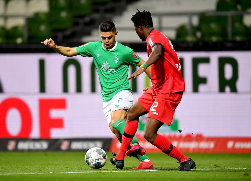 Bayer Leverkusen's Edmond Tapsoba in action with Werder Bremen's Milot Rashica. Reuters