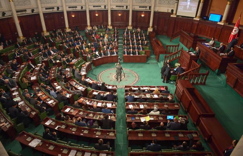 Tunisia's Prime Minister-designate Habib Jemli addresses parliamentarians during a plenary session in the capital Tunis, on January 10, 2020, for a confidence vote on his proposed cabinet line-up. Jemli unveiled on January 2, a proposed government composed of independent figures, after months of negotiations between political parties to fill positions failed. The cabinet of 28 ministers, most of whom are unknown to the general public, including four women, needs to receive parliamentary assent. / AFP / FETHI BELAID
