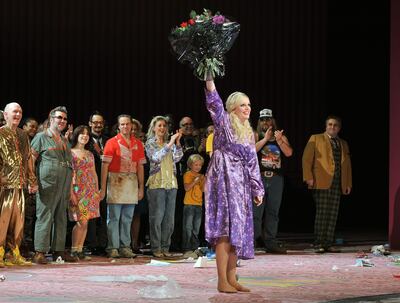 Eva Marie Westbroek (holding flowers) who plays Anna Nicole, waves to the audience during a curtain call for the opera 'Anna Nicole', after the opening performance at the Royal Opera house in Covent Garden central London, this evening.