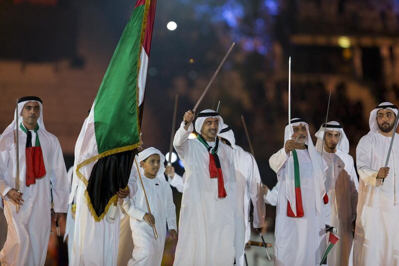 Lt Gen Sheikh Saif bin Zayed, Deputy Prime Minister and Minister of Interior (L), Sheikh Abdullah bin Zayed, Minister of Foreign Affairs (C), Sheikh Nahyan bin Mubarak, Minister of Culture Youth and Community Development (3rd R), and Sheikh Rashid bin Saud, Crown Prince of Umm Al Quwain (R), dance during the 44th UAE National Day celebrations at Zayed Sports City. Philip Cheung / Crown Prince Court - Abu Dhabi