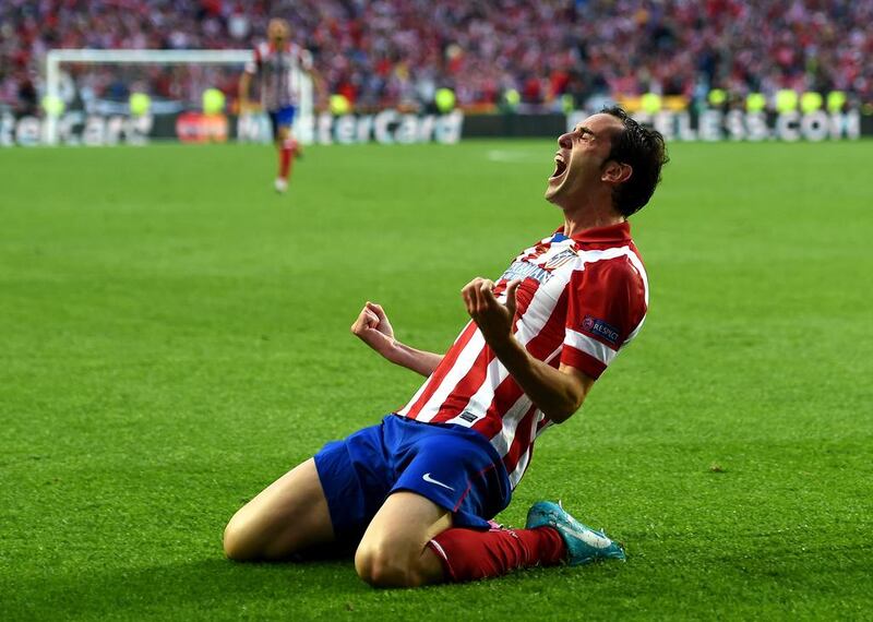 Diego Godin of Atletico Madrid celebrates scoring the opening goal against Real Madrid in the Champions League final. Shaun Botterill / Getty Images / May 24, 2014