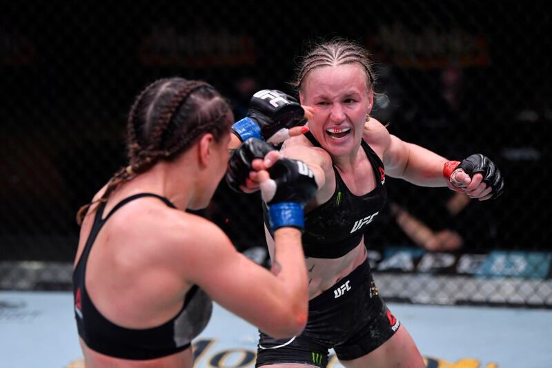 LAS VEGAS, NEVADA - NOVEMBER 21:  (R-L) Valentina Shevchenko of Kyrgyzstan punches Jennifer Maia of Brazil in their women's flyweight championship bout during the UFC 255 event at UFC APEX on November 21, 2020 in Las Vegas, Nevada. (Photo by Jeff Bottari/Zuffa LLC)