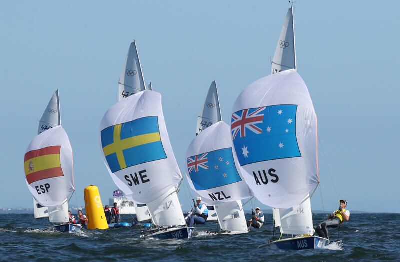 Mathew Belcher and Will Ryan of Australia (R) on their way to win gold in the Men's Two Person Dinghy medal race.