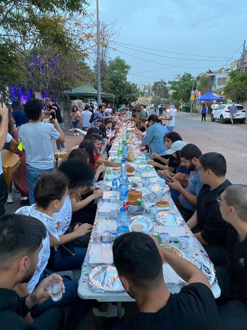 Members of families in Sheikh Jarrah neighbourhood, East Jerusalem, break the Ramadan fast with meals catered by different households  in solidarity with fellow neighbours facing eviction from their homes. Courtsey Asala Abu Hasna