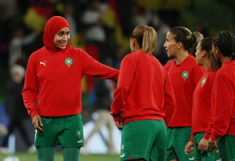 Morocco's Nouhaila Benzina with teammates during the warm up. Reuters