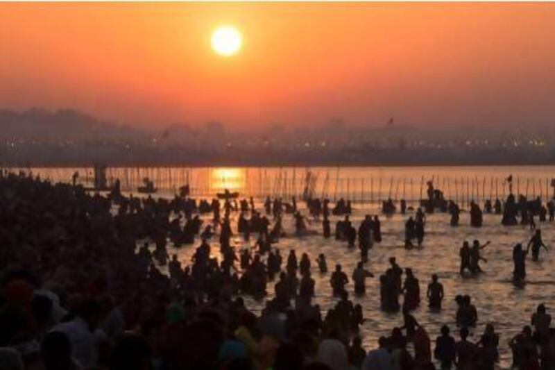 Hindu devotees bathe on the banks of Sangam, the confluence of the holy rivers Ganges, Yamuna and the mythical Saraswati, during the Kumbh Mela in Allahabad, India, last month. Daniel Berehulak / Getty Images