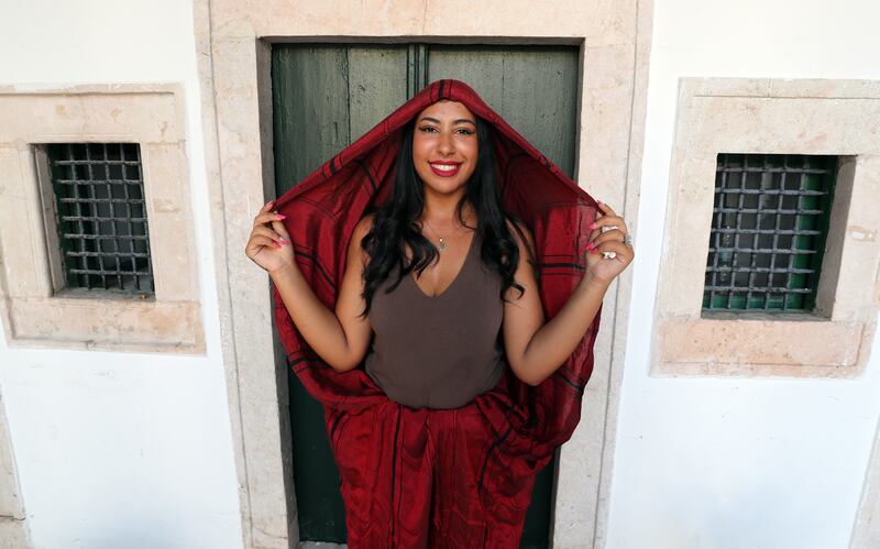 A Tunisian woman wears a traditional veil called 'Sefseri' on National Women's Day in Tunis. The Sefsari is a traditional feminine veil in silk, cotton or satin worn in the Maghreb.  