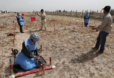 Women participate in efforts to clear landmines in Basra, Iraq March 27, 2021. Picture taken March 27, 2021. REUTERS/Mohammed Aty. NO RESALES. NO ARCHIVES.