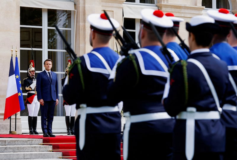 Mr Macron stands during his swearing-in ceremony. Reuters