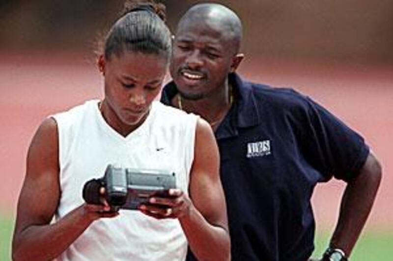 Marion Jones, the Olympic Gold medallist, with her former coach Trevor Graham. Jones was sentenced to six months in prison for lying to US federal agents about her use of steroids.
