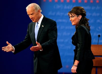 FILE PHOTO: Democratic vice presidential nominee Senator Joe Biden (D-DE) (L) and Republican vice presidential nominee Alaska Governor Sarah Palin appear onstage during the vice presidential debate at Washington University in St. Louis, Missouri October 2, 2008. REUTERS/Carlos Barria/File Photo