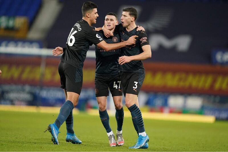 Manchester City''s Phil Foden (C) celebrates with teammates after scoring his team's first goal in the 3-1 Premier League win at Everton. AFP