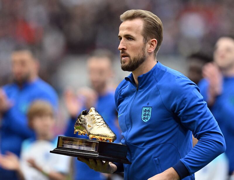 Harry Kane after receiving a trophy for becoming England's record goalscorer ahead of the Euro 2024 win over Ukraine at Wembley Stadium, on March 26, 2023. AFP