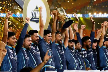 The Gujarat Titans celebrate with the trophy following their IPL final win. Photo: IPL League