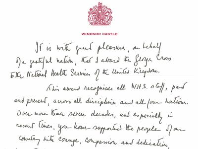A copy of the handwritten message from Queen Elizabeth in support of the award of the George Cross to the UK's NHS. AP Photo