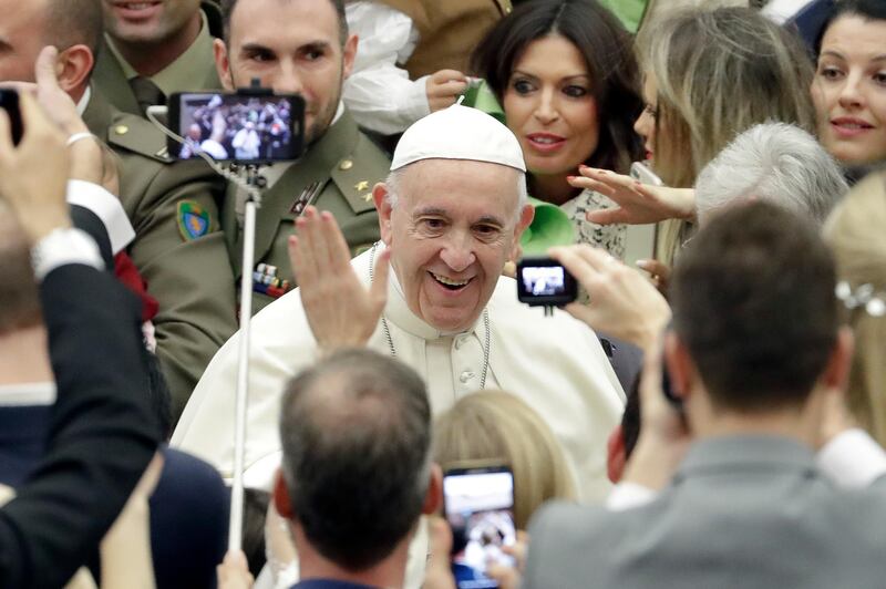 Pope Francis arrives for his weekly general audience, in the Pope Paul VI hall, at the Vatican, Wednesday, Dec. 5, 2018. (AP Photo/Andrew Medichini)