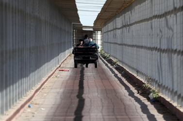 A Christian Palestinian couple riding an auto rickshaw leaves Gaza Strip through Israeli Erez crossing heading to Bethlehem to attend Christmas celebrations, in the northern Gaza Strip December 24, 2019. Reuters