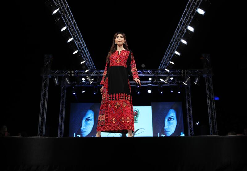 A model presents a creation from the collection of Jordanian designer Fatima Abu Rub during the Arabian Traditional Fashion Show 'Folklore 2022' in Dubai, United Arab Emirates, 10 March 2022.   EPA / ALI HAIDER