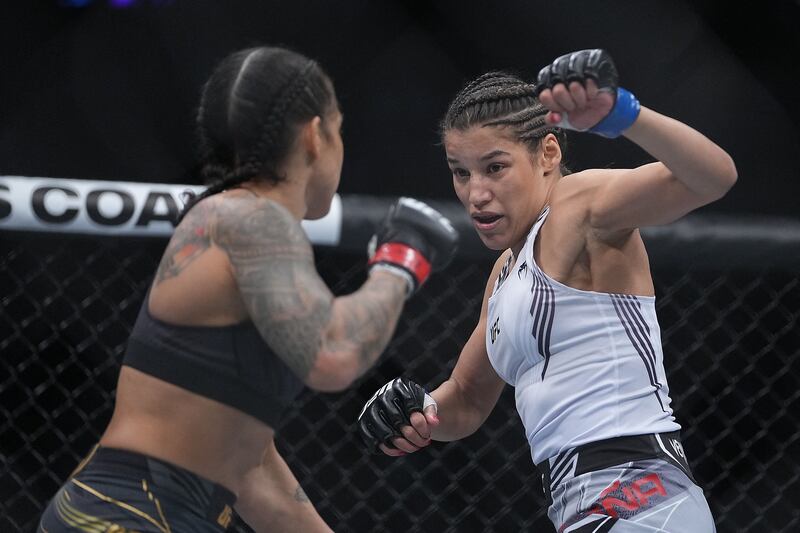 Julianna Pena defends against Amanda Nunes. Reuters