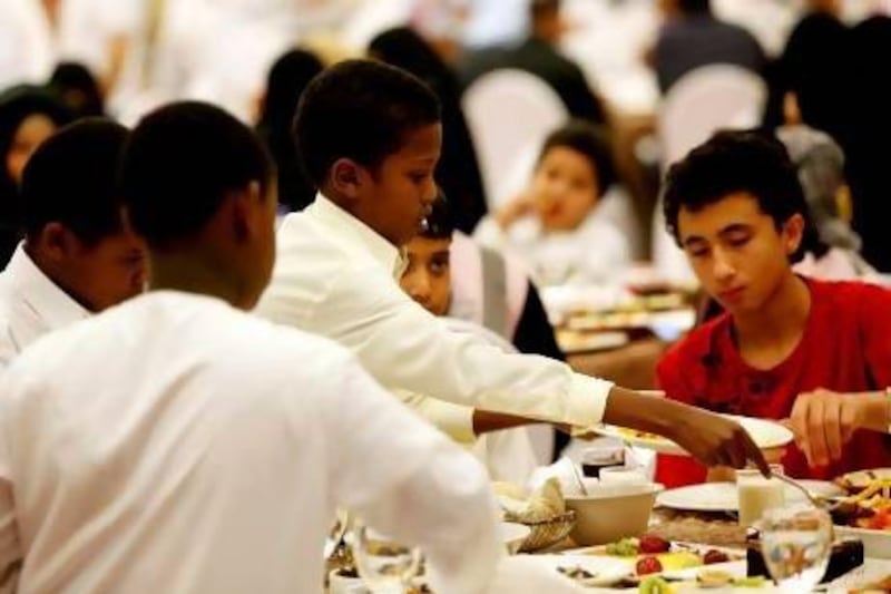 Orphans at an iftar organised by Al Ihsan Charity Association at the Ramada Hotel in Ajman.  Satish Kumar / The National