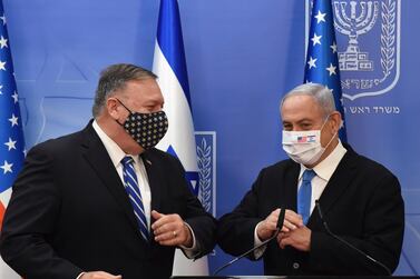U.S. Secretary of State Mike Pompeo and Israeli Prime Minister Benjamin Netanyahu wear face masks to help prevent the spread of the coronavirus after they make joint statements to the press, in Jerusalem, Monday, Aug. 24, 2020. (Debbie Hill/Pool via AP)