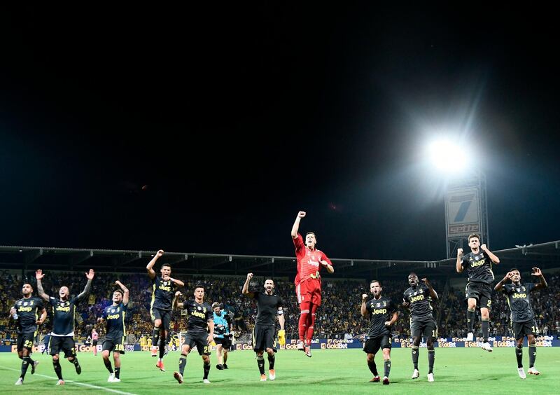 Juventus players celebrate in front of their fans after defeating Frosinone. AFP