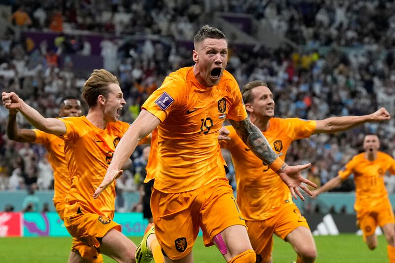 Wout Weghorst celebrates after making it 2-2. AP